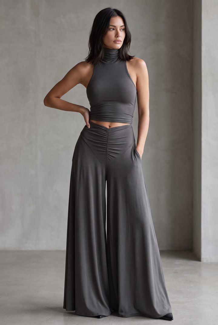 Charcoal gray stretch knit turtleneck halter dress with cutout waist - front view