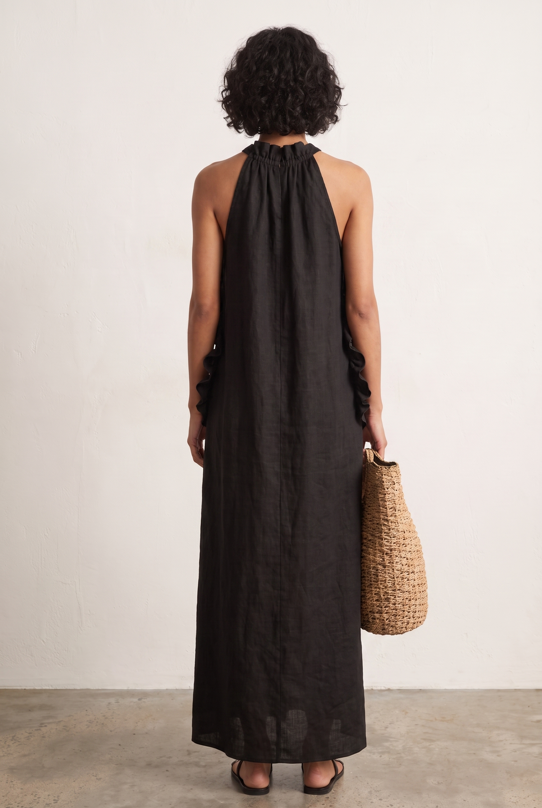 Black linen blend sleeveless maxi dress with ruffle details - back view